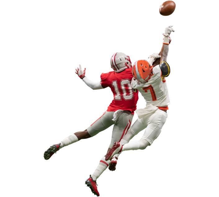 Football players go up for the ball