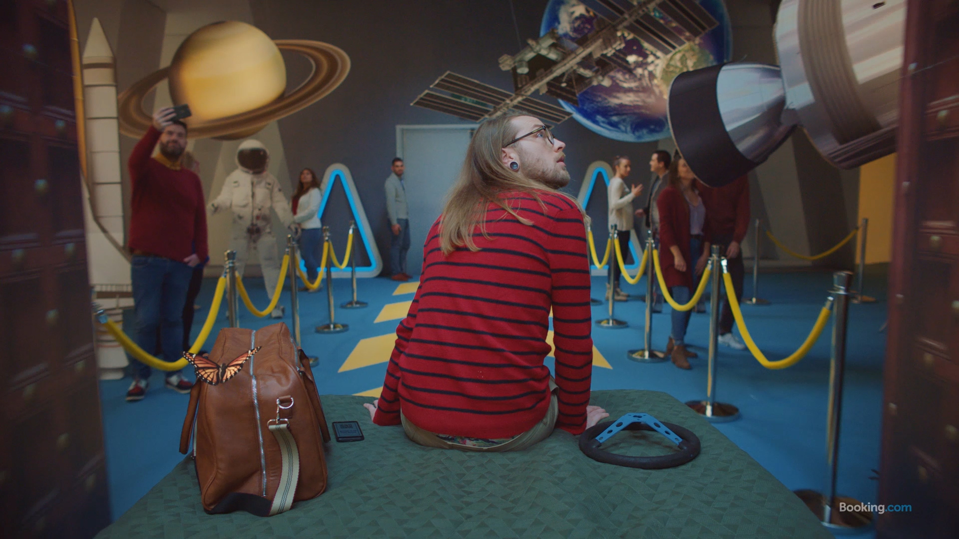 A person staring at film equipment on set