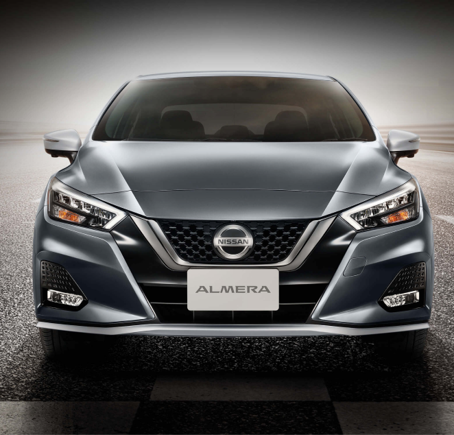A grey nissan car on the road