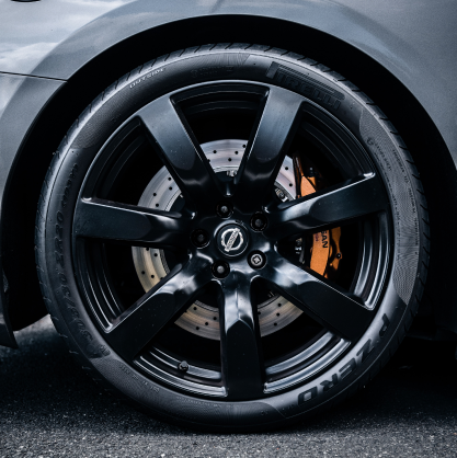 Nissan car wheel with a black rim