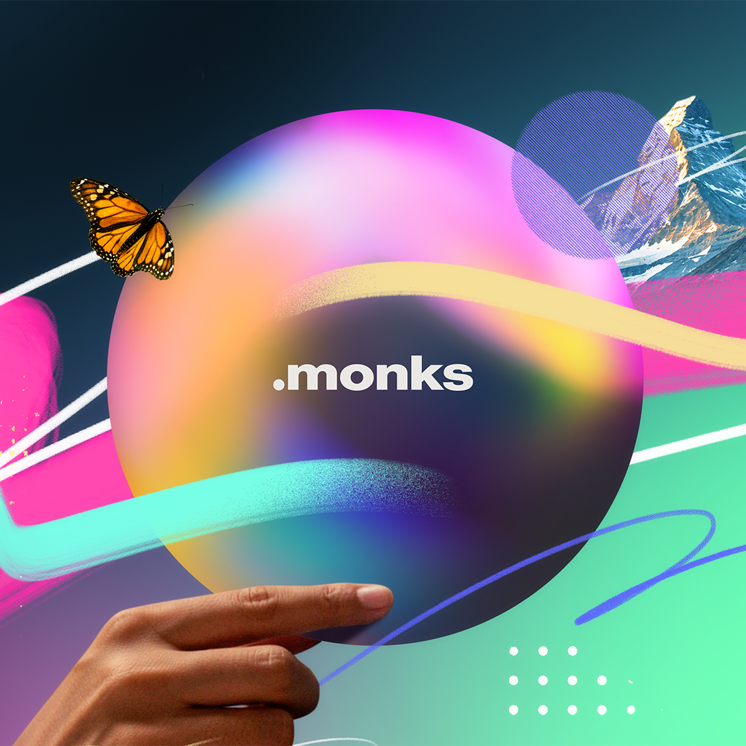 A hand holding a colorful globe with a butterfly and mountain in the background