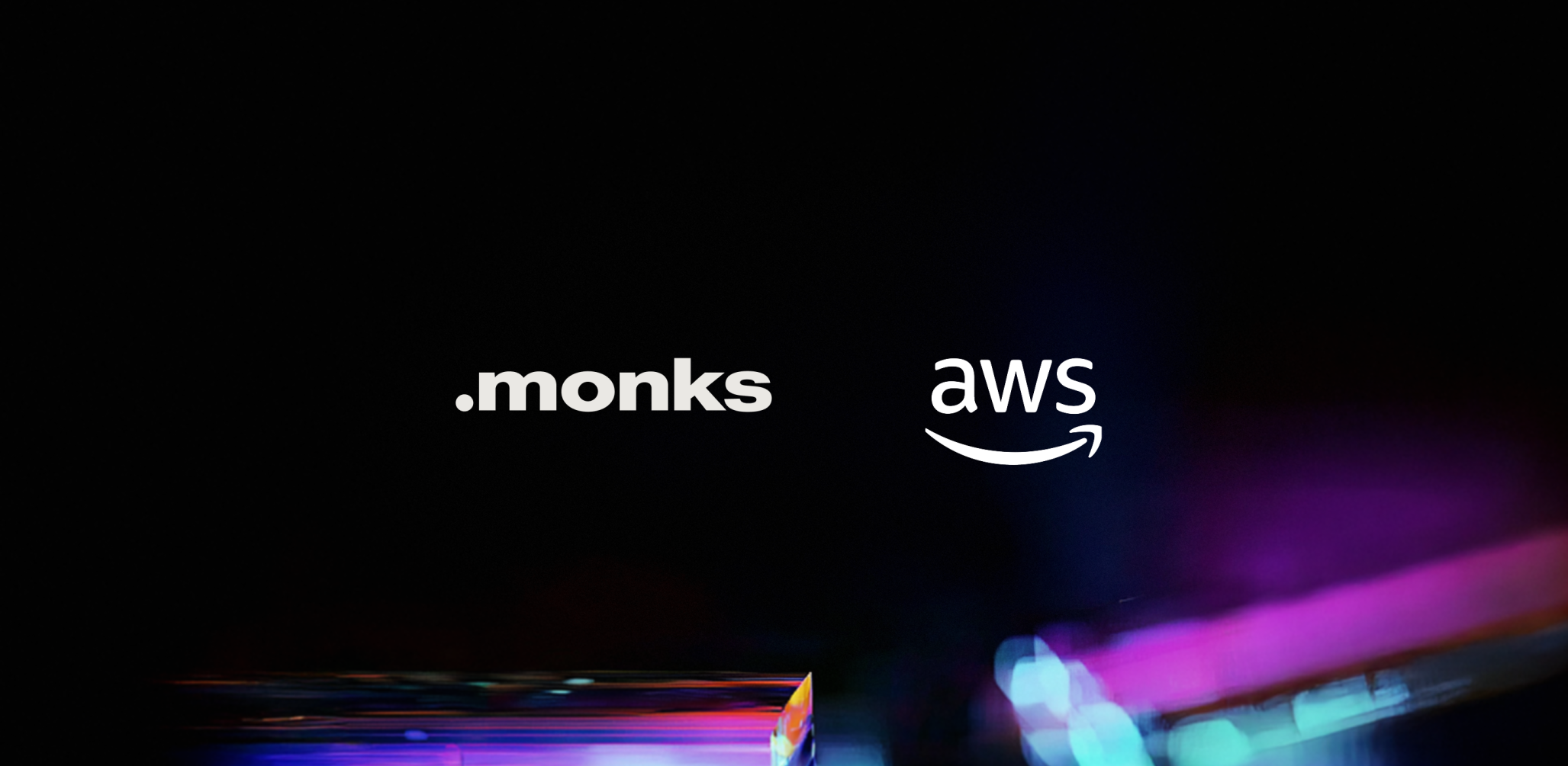 Image of the Monks and AWS logos side-by-side against a black backdrop.