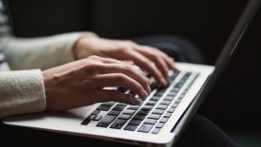 Hands on a laptop