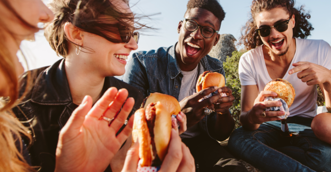 A group of people enjoying hamburgers