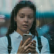 woman with pixelated face holding phone