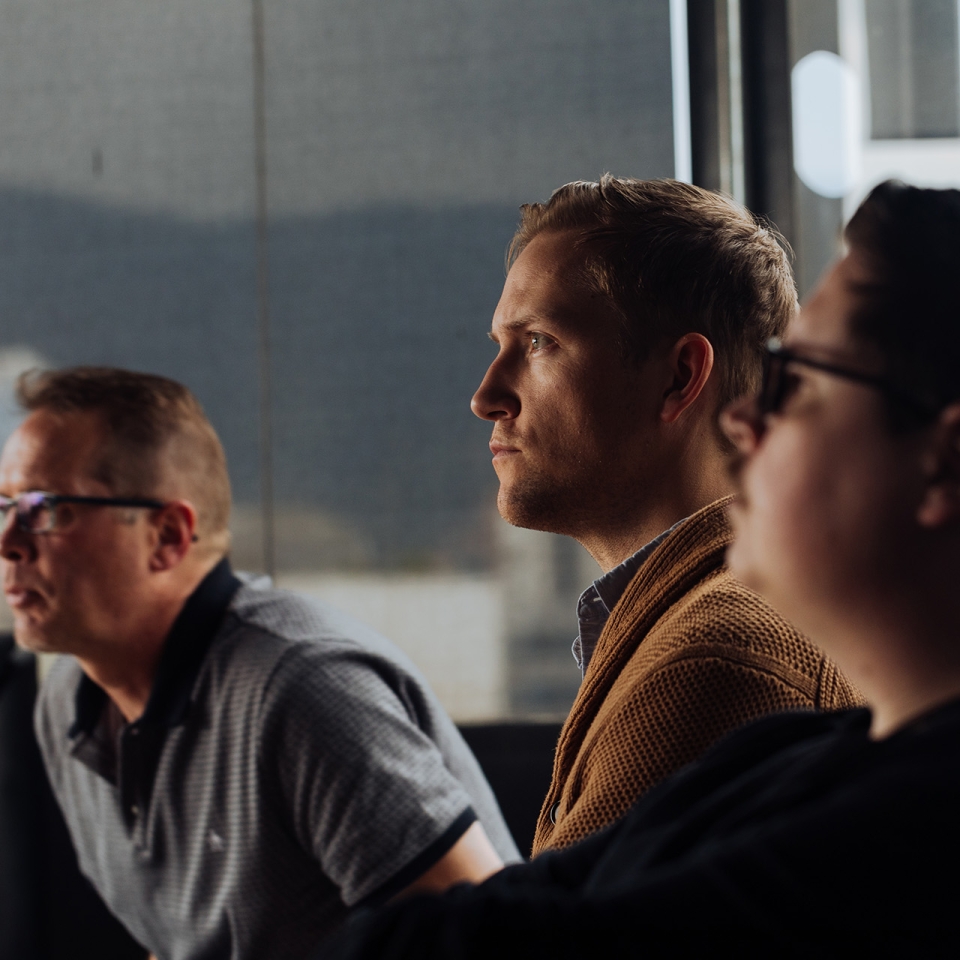 Tech workers listen in on a virtual meeting