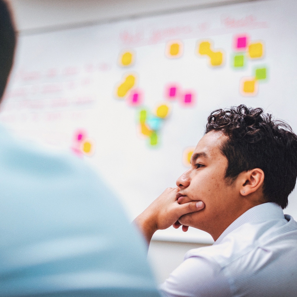 People listening to a speaker in a conference room