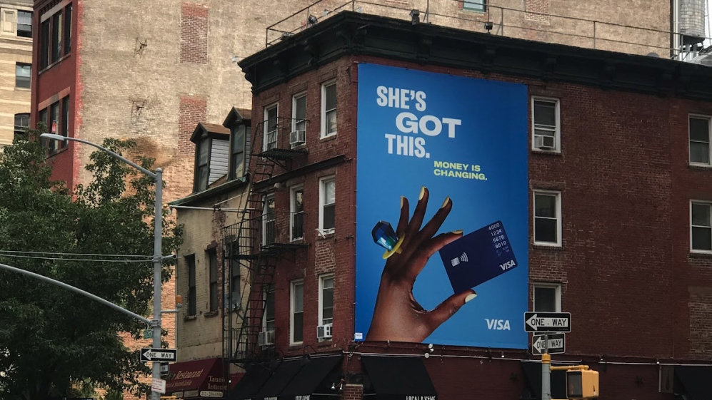 A billboard ad on a street in new york city